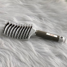 Load image into Gallery viewer, Hairbrush with bristle design on a fluffy gray surface
